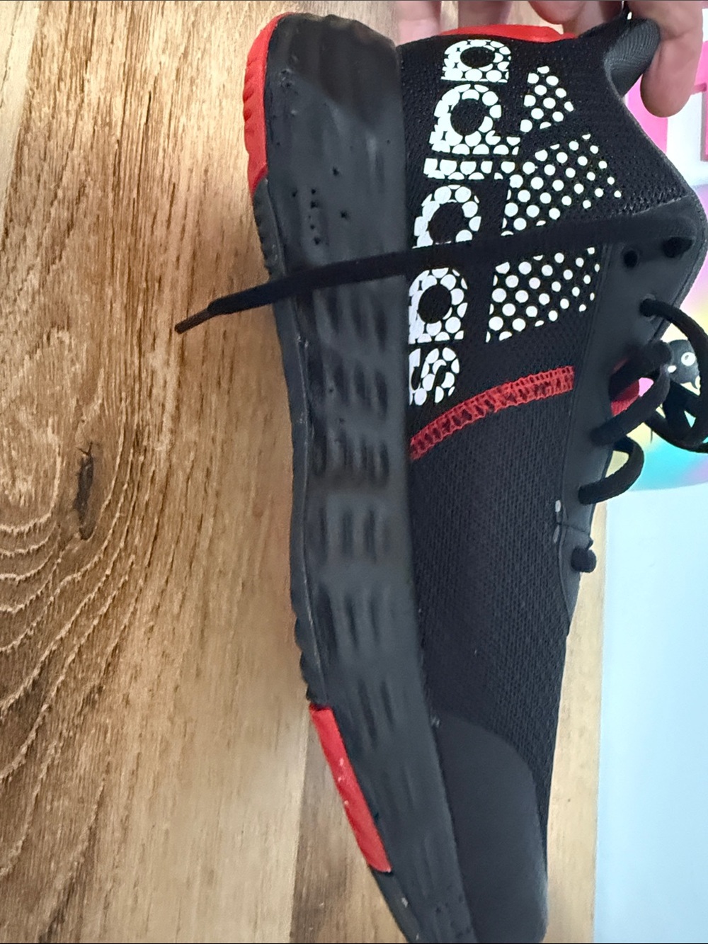 adidas Black Athletic Shoe with Red Accents and White Logo